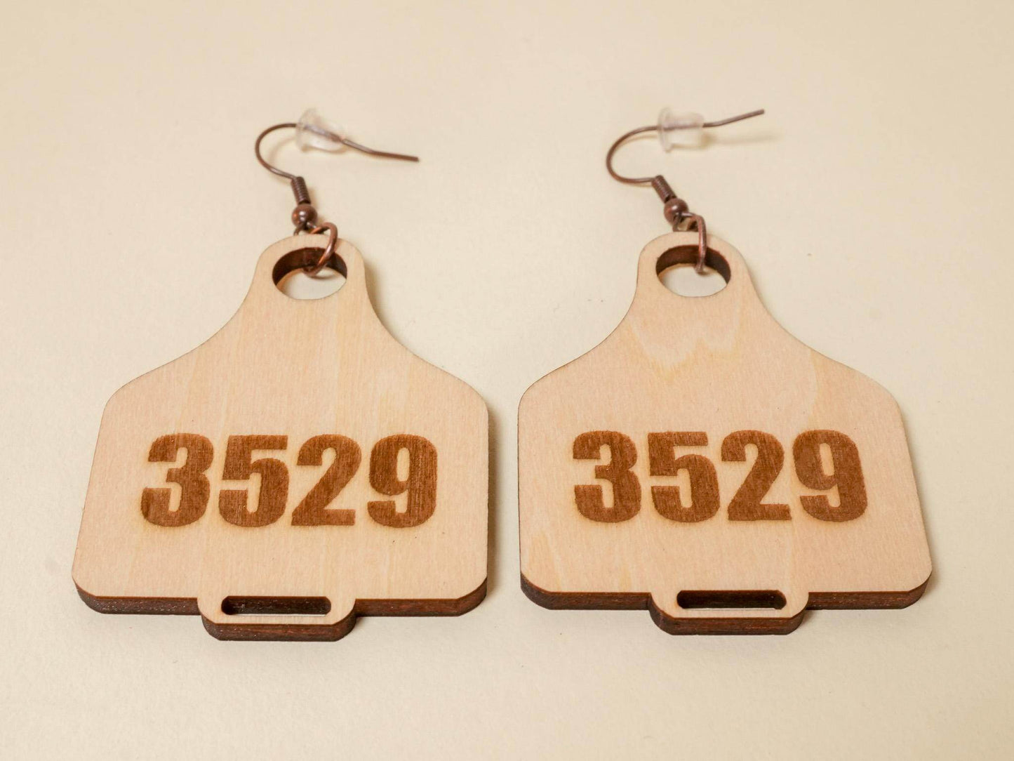 Bound by Dave wooden cow tag earrings engraved with number 3529 and metal hooks