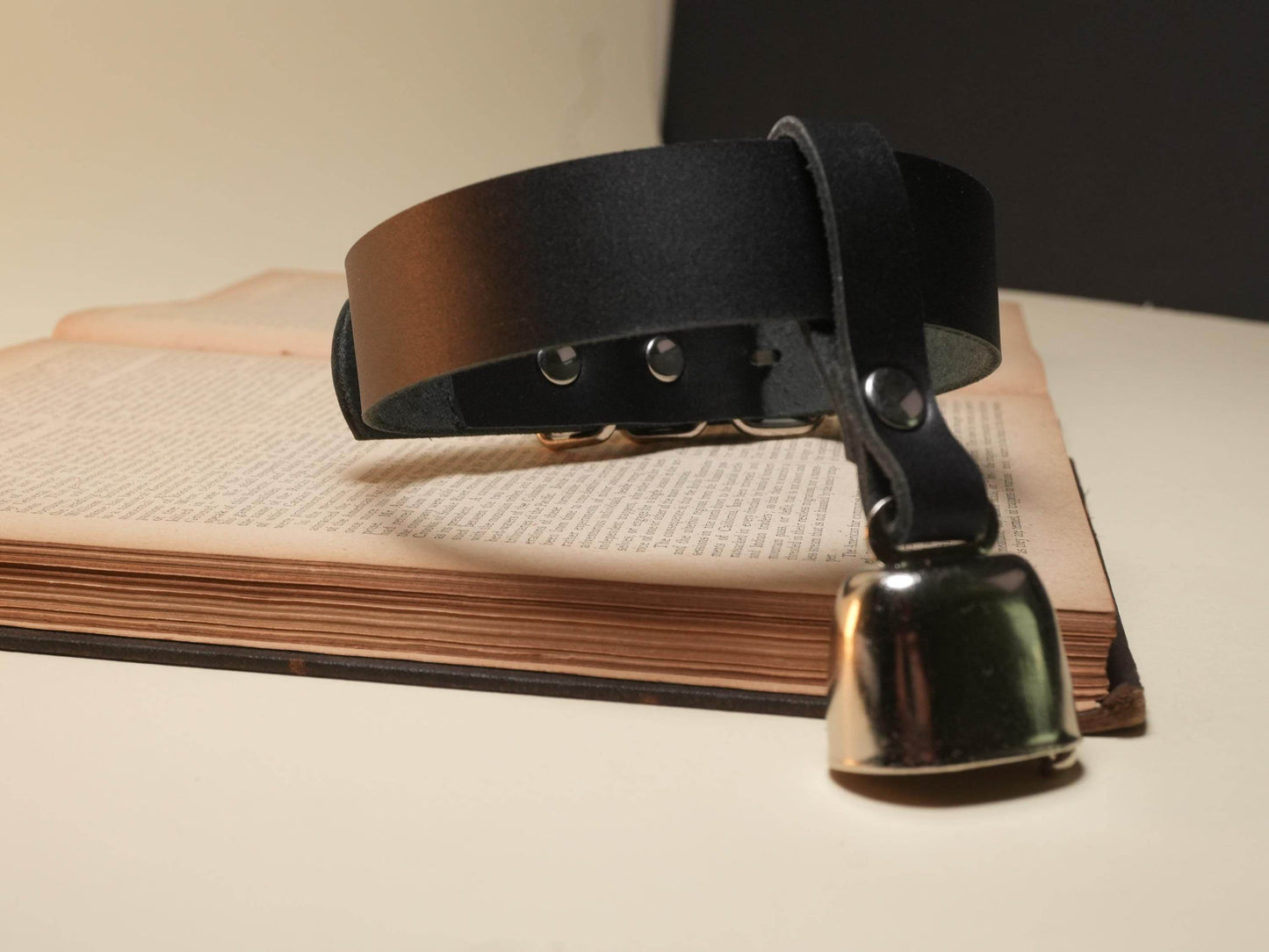 Black leather collar with metal bell by Bound by Dave designed for hucow roleplay