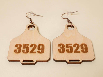 Bound by Dave wooden cow tag earrings engraved with number 3529 and metal hooks