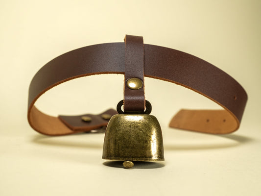 Bound by Dave leather strap with vintage brass cowbell attached for decorative or functional use