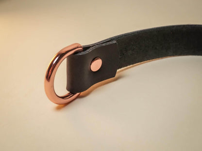 Black leather strap with rose gold metal hardware detail from Bound by Dave Heart Lock collection