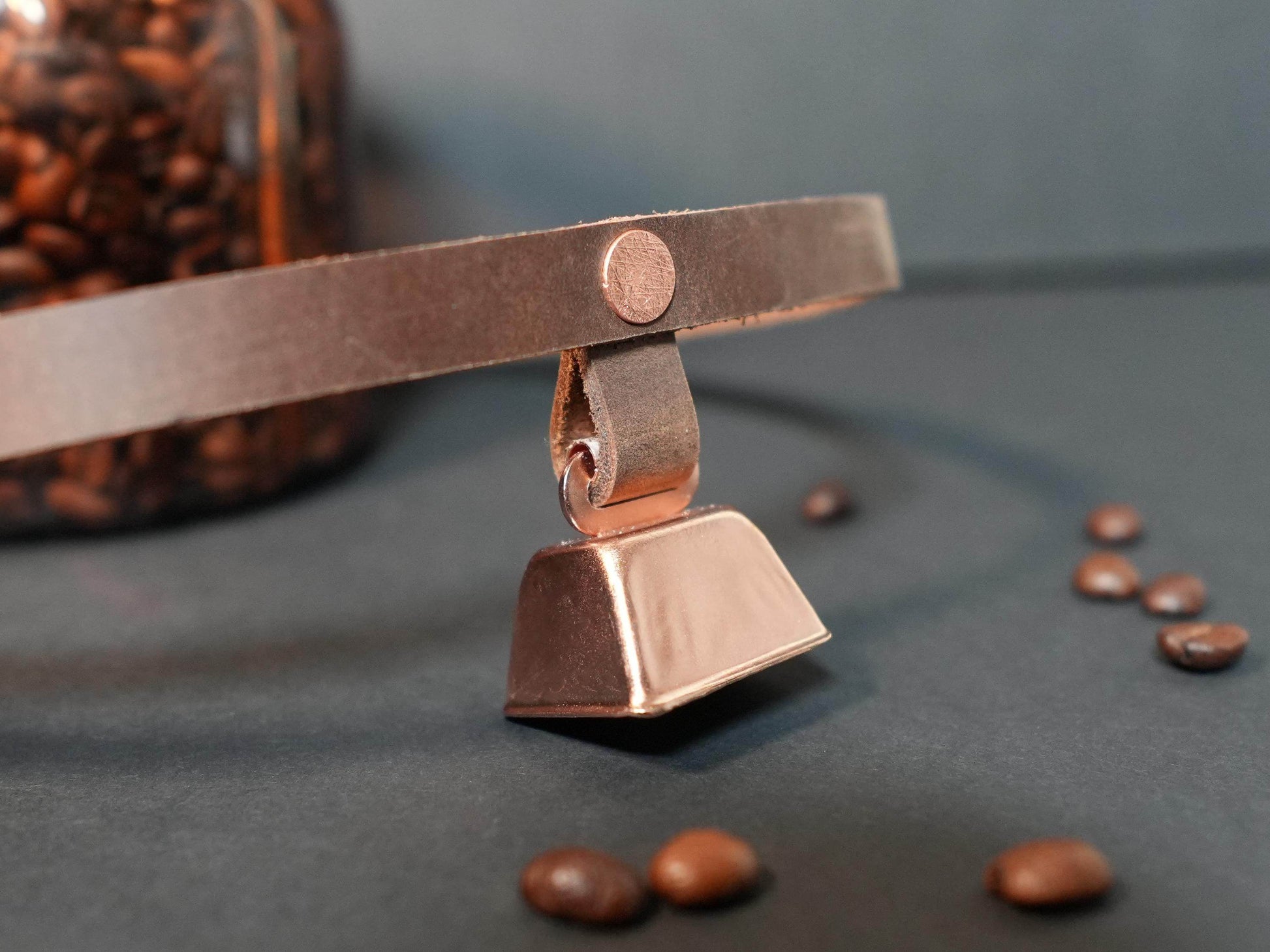 Bound by Dave hucow choker with metallic bell pendant on brown leather strap close-up