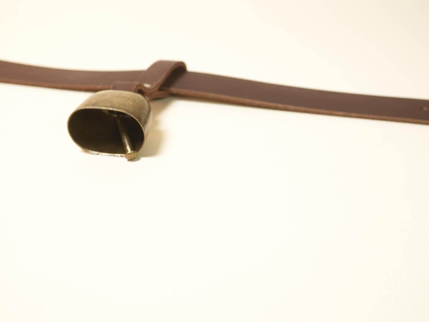 Bound by Dave brown leather Hucow Collar with metal bell on white background