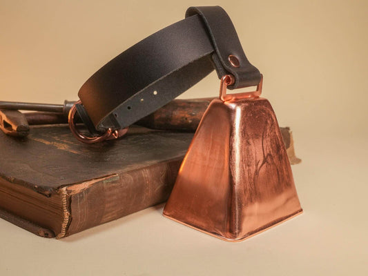 Bound by Dave Hucow Collar featuring a black leather strap with a large copper bell attached