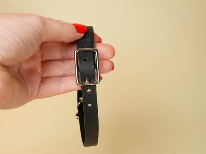 Bound by Dave black leather Kitten Collar held by hand with silver buckle detail