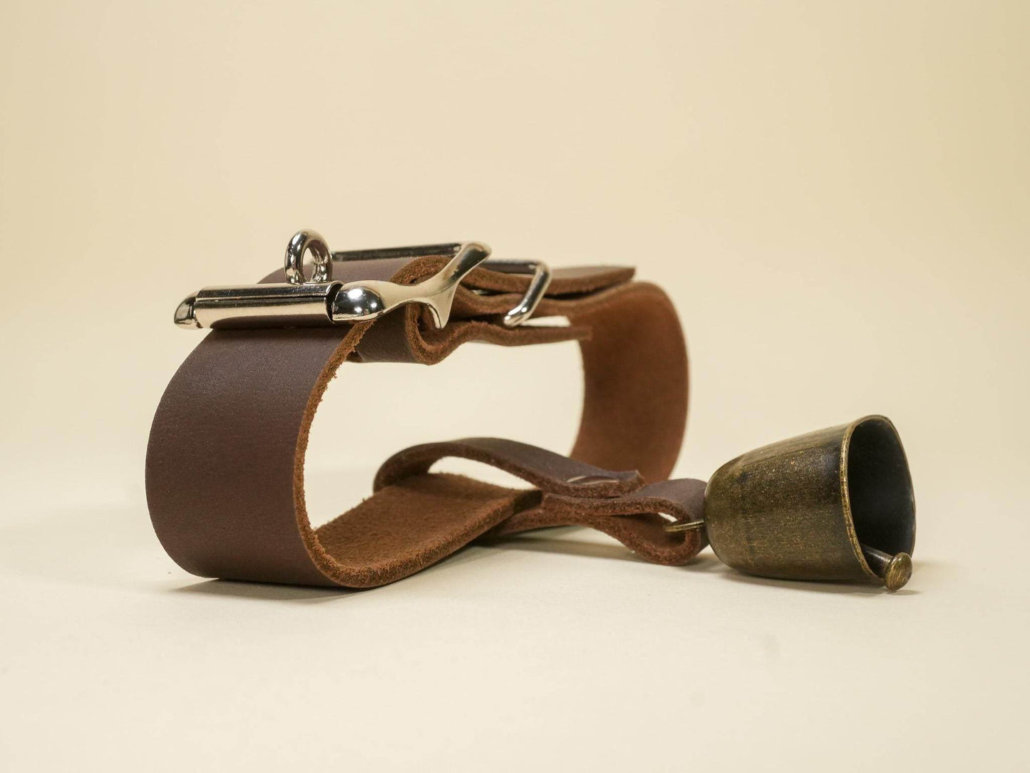 Bound by Dave Locking Hucow Collar in brown leather with metal buckle and attached bell
