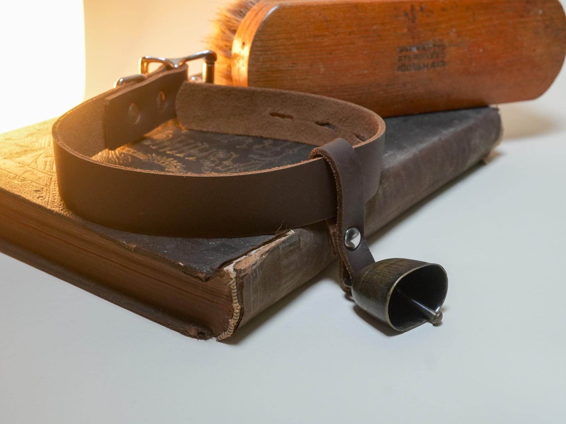 Bound by Dave leather Locking Hucow Collar with attached small bell on vintage books