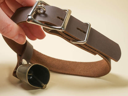 Brown leather Locking Hucow Collar with metal buckle and attached bell by Bound by Dave