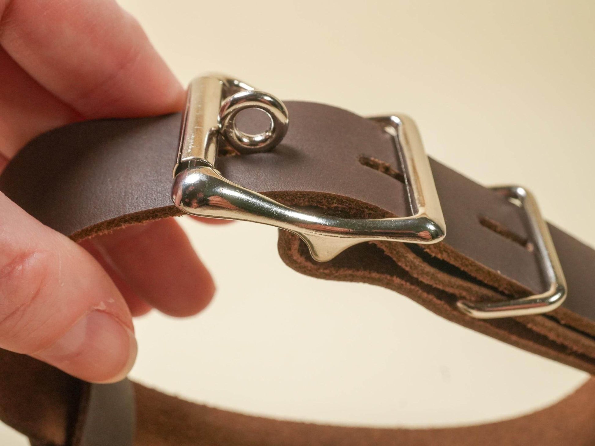 Bound by Dave Locking Hucow Collar close up showing brown leather strap and silver locking buckle
