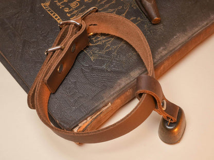 Bound by Dave Locking Hucow Collar made of brown leather with metal buckle and bell attached
