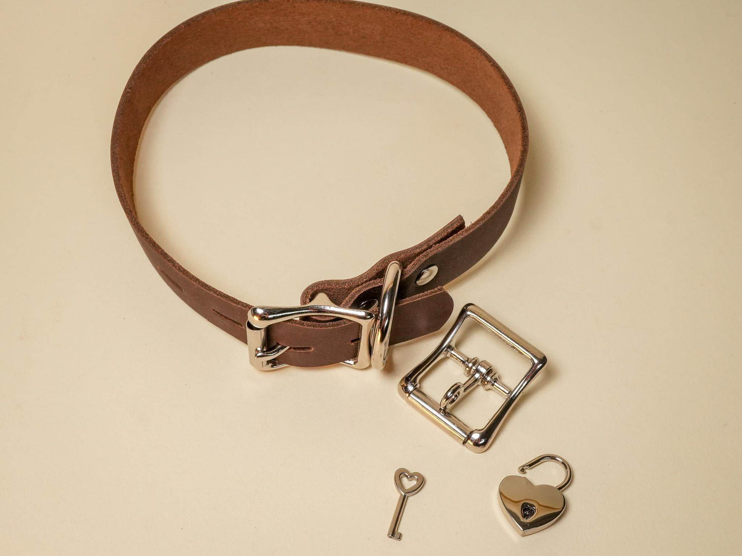Bound by Dave Locking Sub Collar in brown leather with silver buckle and heart-shaped lock key